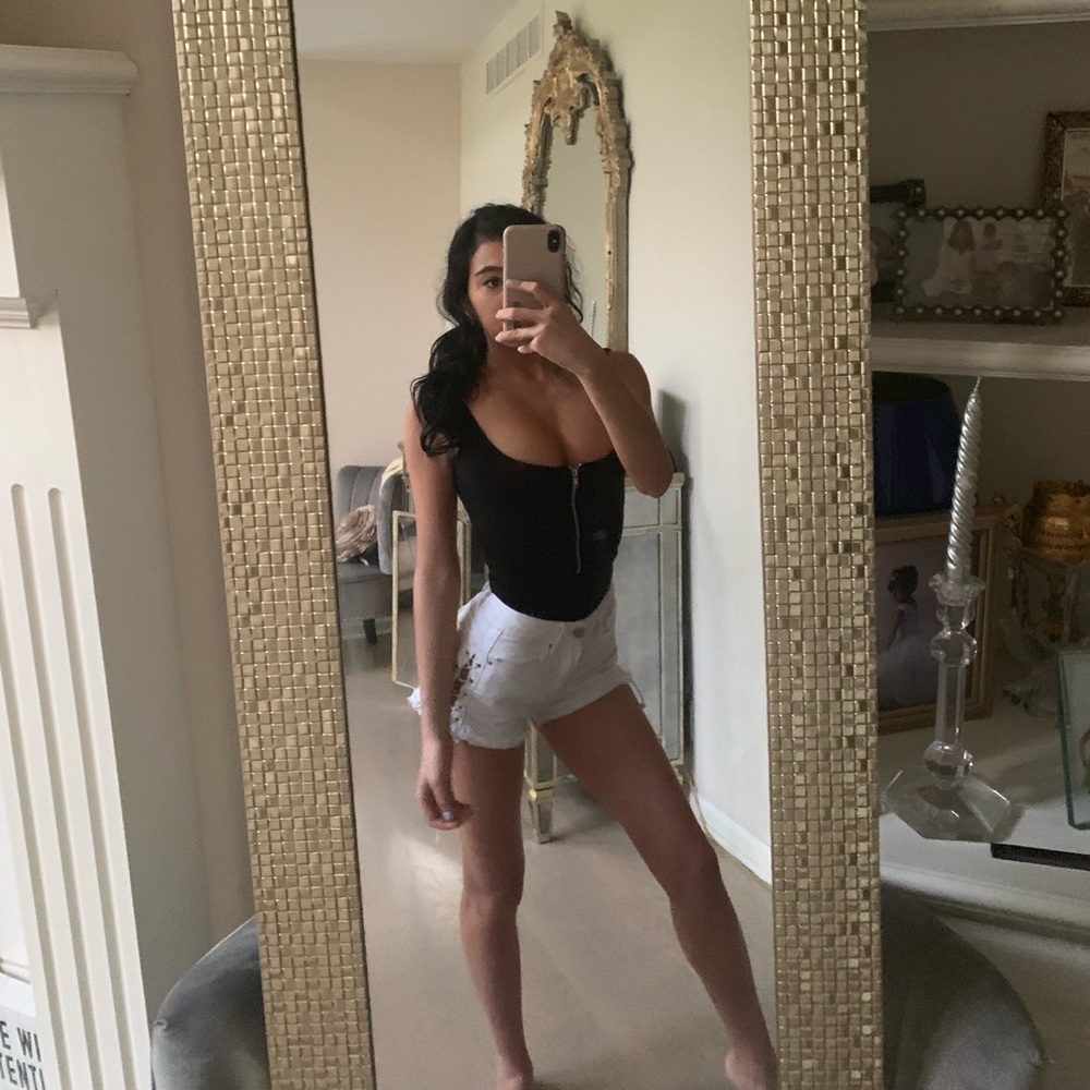 Pretty little thing. Zip up body suit.